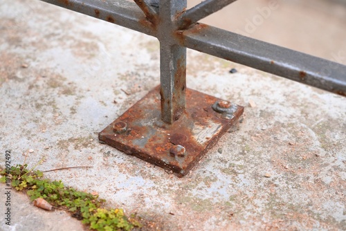 Fotografija Steel post shoe screwed to concrete