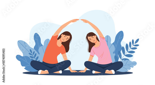 Two young women sit on yoga mats and perform side stretch exercises together in a studio with large green leaves in the background.
