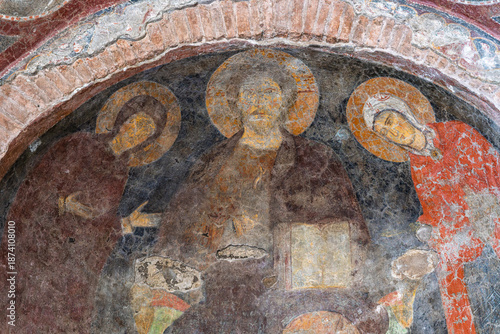 Photos Italy - Rome - Temple of Romulus - Closeup of an ancient Christian fresco featuring three saints adorned with golden halos, a religious artwork
