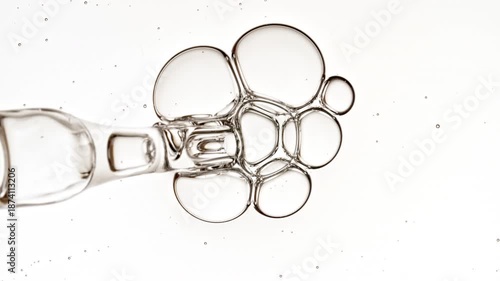 Bubble cluster transparent, cells under a microscope on white background. Gel texture with bubbles, skin care product. Macro Shot of Natural Organic Cosmetics, Medicine. High quality 4k footage