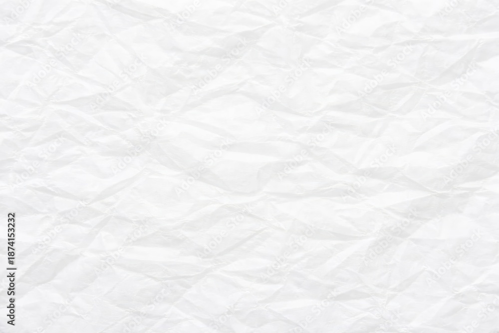 Obraz premium Fine creased white tissue paper surface with gentle highlights and clean texture background copy space