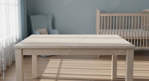 Light wood table in nursery with crib and chair in soft light