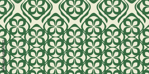 Repeating pattern of green floral motifs on a light background