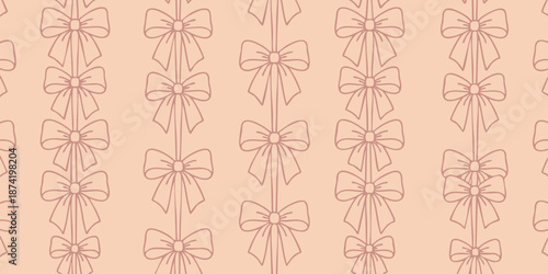 A seamless pattern of bows on a soft peach background viewed from directly above