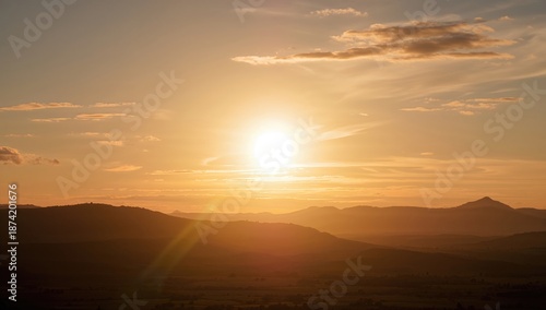 Wallpaper Mural Sunset casting amber light across a peaceful scene, used as an editorial header background, seasonal change Torontodigital.ca