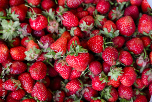 Bright background of colorful strawberries