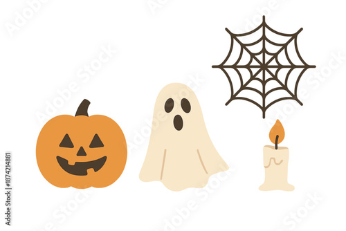 Halloween decorations including a pumpkin, a ghost, a spider web, and a candle in a simple arrangement