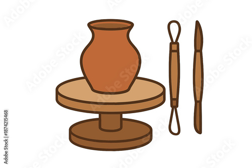 Pottery wheel sits with a clay pot and tools for shaping on a work surface in a studio setting during daylight hours