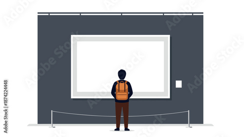 Man with backpack looking at art exhibit in modern gallery setting