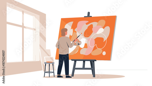Artist creating abstract art on canvas in a studio