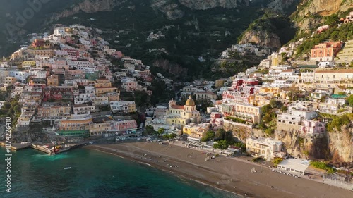 Wallpaper Mural Positano on the Amalfi Coast in southern Italy, colorful cliffside houses above the Tyrrhenian Sea creating iconic Mediterranean travel destination. Aerial View reveals dramatic coastal landscape Torontodigital.ca