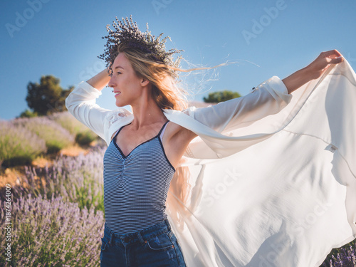 Blonde caucasian woman enjoying life in lavender field