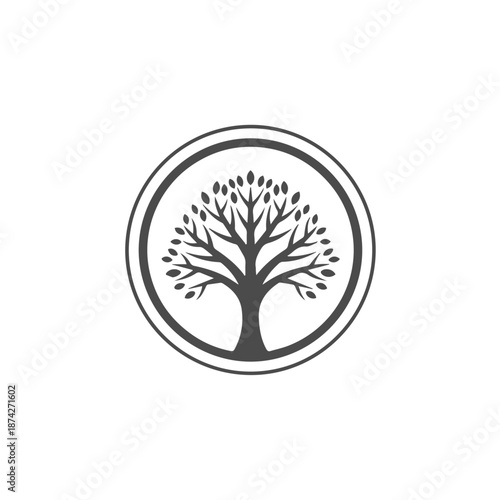 A simple yet elegant graphic of a tree enclosed within a circular frame. The tree has a sturdy trunk and numerous branches adorned with leaves, symbolizing growth and life.