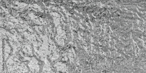 A detailed, grayscale abstract texture resembling weathered rock or rough organic material with intricate lines and varied shading, offering a natural and tactile visual surface