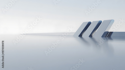 A minimalist composition showcases sleek white geometric structures gently rising from a blurred monochromatic landscape evoking serenity high quality