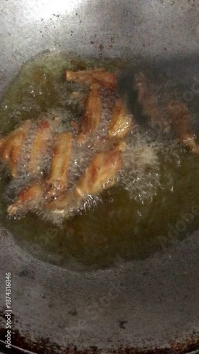 Cooking fried chicken. Frying chicken in the pan in hot oil