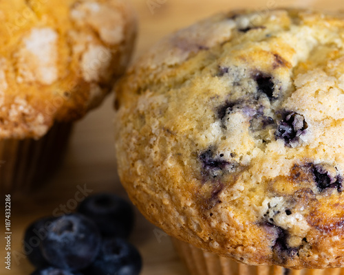 Wallpaper Mural A close-up shot of two blueberry muffins, with a few fresh blueberries scattered in the foreground. Torontodigital.ca