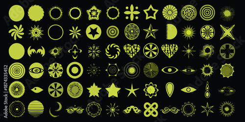 An assortment of glowing yellow abstract shapes and symbols on black