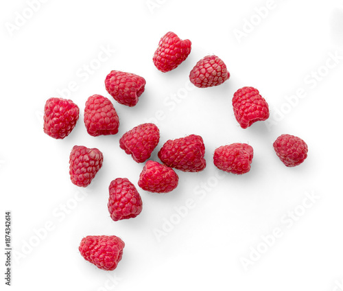 Vibrant Raspberries in Close-Up on a White Background. Top view of scattered raspberries isolated.