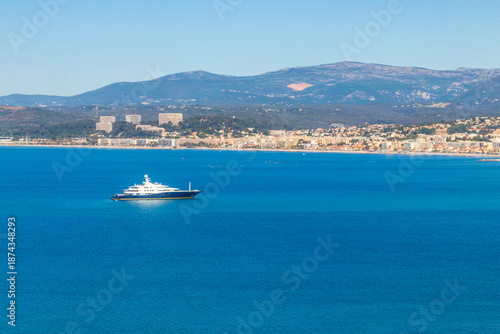 Ship sailing along the coast of the French Riviera near Nice, France
