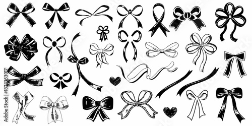 An assortment of decorative black and white ribbon bows and floral elements