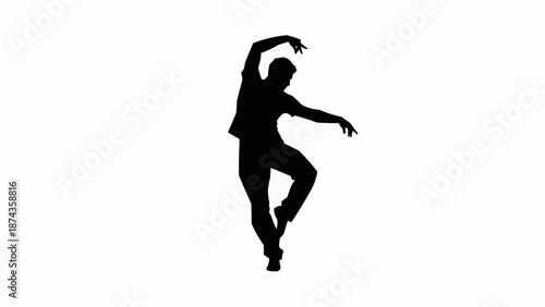 Silhouette of a male dancer performing a graceful ballet pose.