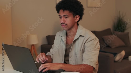 Young Man Working From Home on Laptop