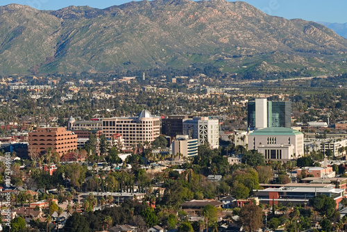 Downtown Riverside seen from Mount Rubidoux, California, showing dense city blocks, palm trees, offices, and neighborhoods across the valley.