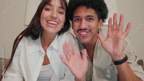 Happy Couple Chats on Sofa at Home