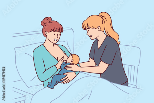 Attentive nurse demonstrates the correct way to hold and feed a newborn baby boy to a new mother. Postpartum education and support for mothers learning infant care in a medical facility.
