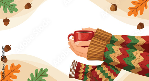Cozy embrace of a warm beverage in a patterned sweater amidst autumn's bounty of acorns and leaves a serene seasonal moment