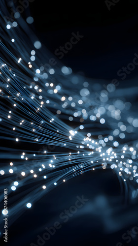 Fiber optic cable light strands glowing in motion creating abstract bokeh and dynamic blue network energy
