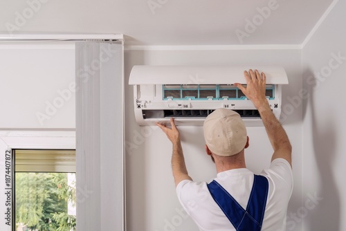 Expert maintenance service for air conditioning unit in residential apartment