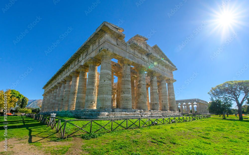 Fototapeta premium The ancient Greek temple of Hera in Paestum, Italy. Famous archaeological site of Paestum, Magna Graecia, ancient ruins.