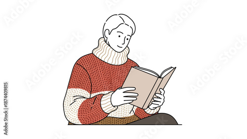 Young adult man wearing a cozy sweater sits and reads an open book with a relaxed expression on a plain background for a concept of leisure and