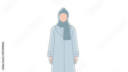 Young woman wearing a light blue winter coat hijab and scarf stands outdoors during cold weather