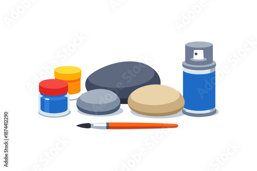 Art supplies and painted stones with spray can and paintbrush on white