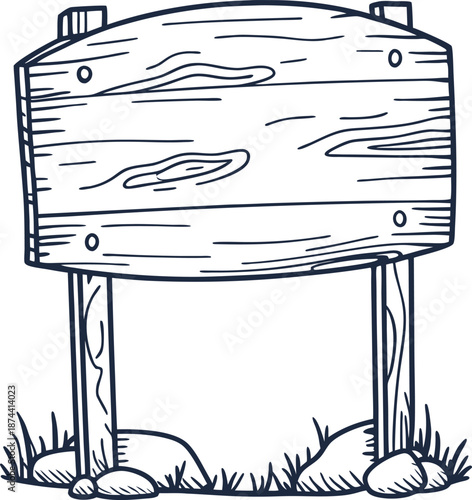 wooden signboard with natural wood texture standing on stones and grass