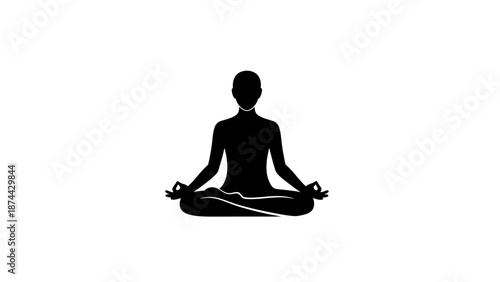 Silhouette of a person meditating in lotus pose.