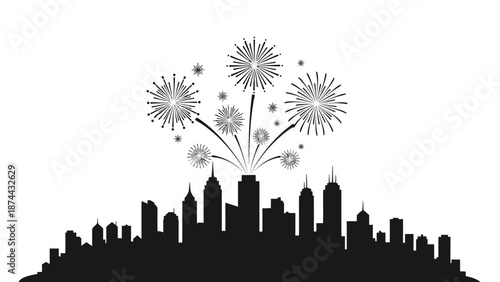 Black and white cityscape with celebratory fireworks bursting above the skyline.