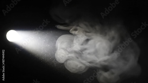 Abstract Spotlight Beam with Smoke and Dust Particle Effects on Black Backdrop