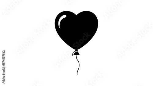 Black heart shaped balloon floating gently in the air.