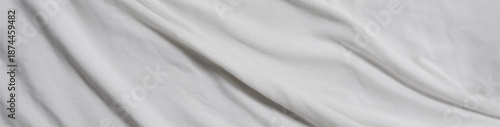White crinkled fabric background, white fabric patterned background.