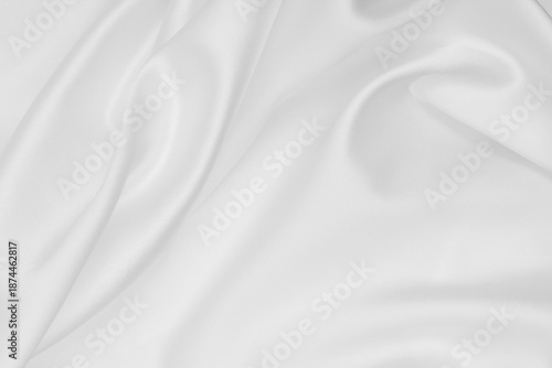 Smooth elegant white silk or satin luxury cloth texture as wedding background. Luxurious background design