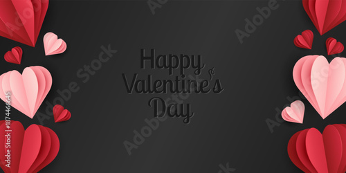 Red and pink paper cut hearts on black background with Happy Valentine Day lettering