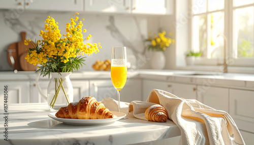 sunlight croissants, a champagne glass with mimosa, and chair