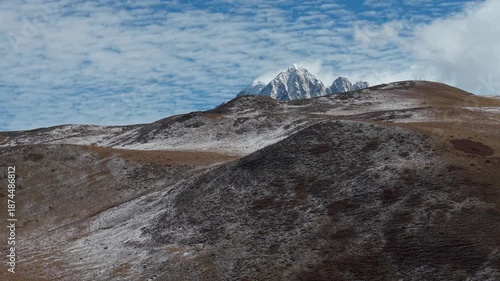 Drone Reveal Shot of Yala Snow Mountain in Winter