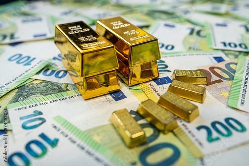 Stack of gold bars on euro banknotes representing wealth, fortune and long term financial growth