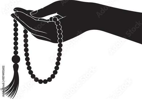 A dark silhouette of a human hand gracefully holding a string of prayer beads with a tassel