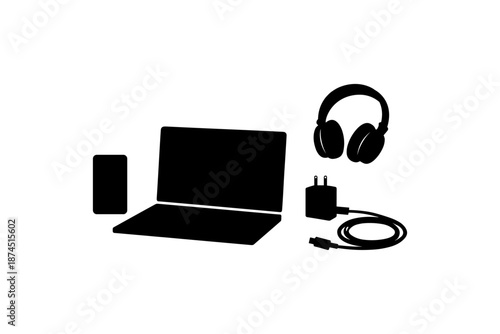 Silhouette of laptop and gadgets with headphones and charger